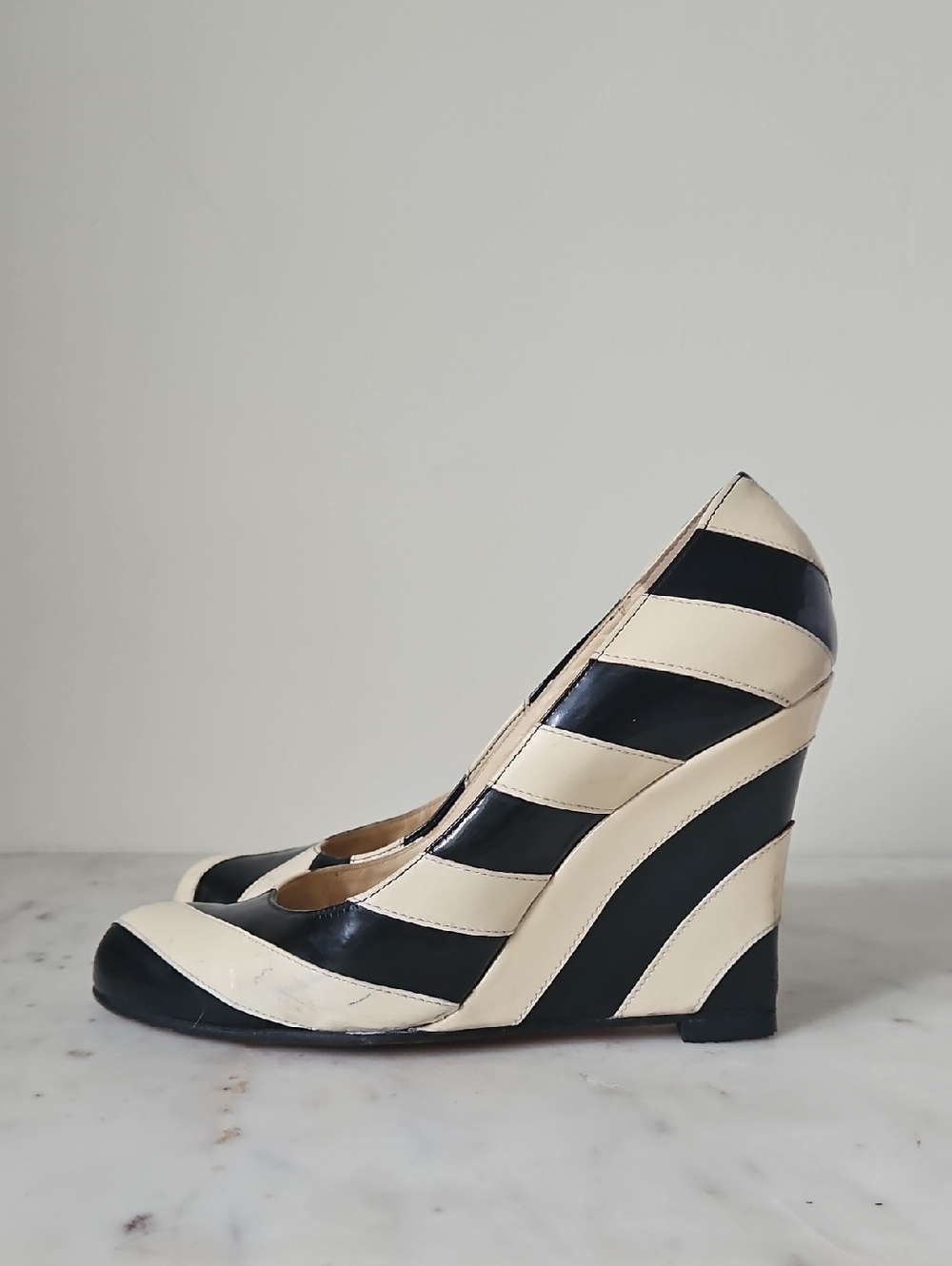 CHRISTIAN LOUBOUTIN: Sing Sing Black and Cream Striped Patent Wedge Pumps